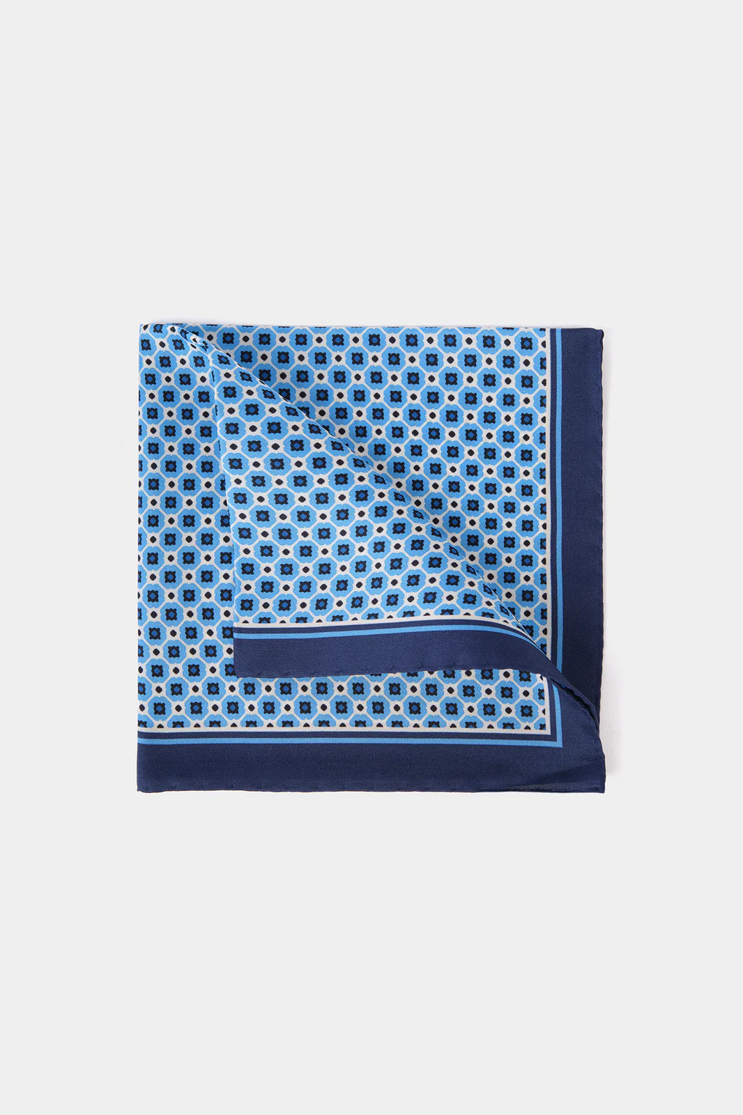 Pochette fond bleu lumineux à motif géométrique blanc et marine